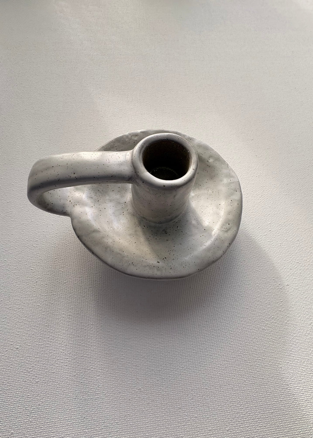 Ceramic candle holder on a light gray background